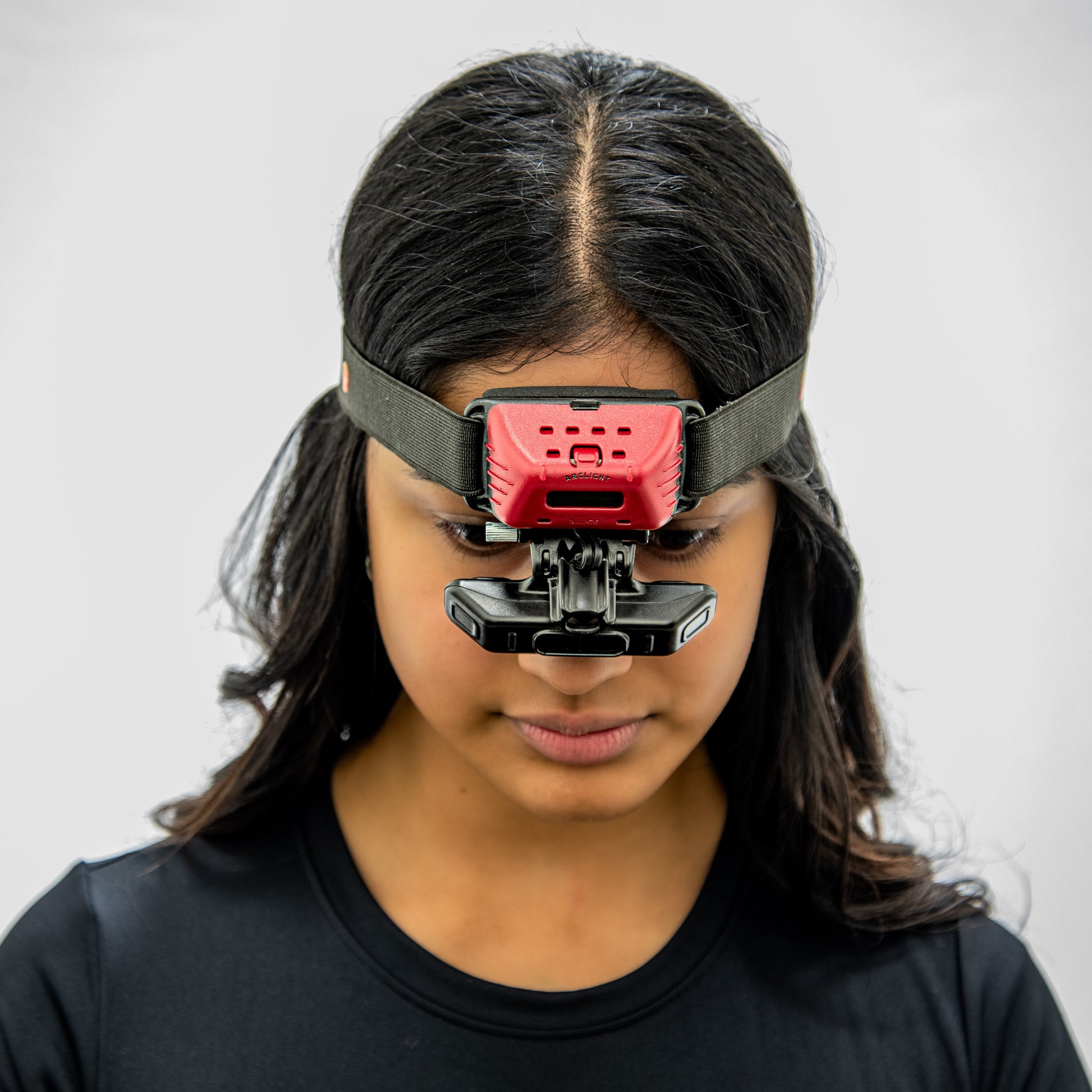 Holo BIO in place on head of woman, centred around nose with eyepieces over eyes